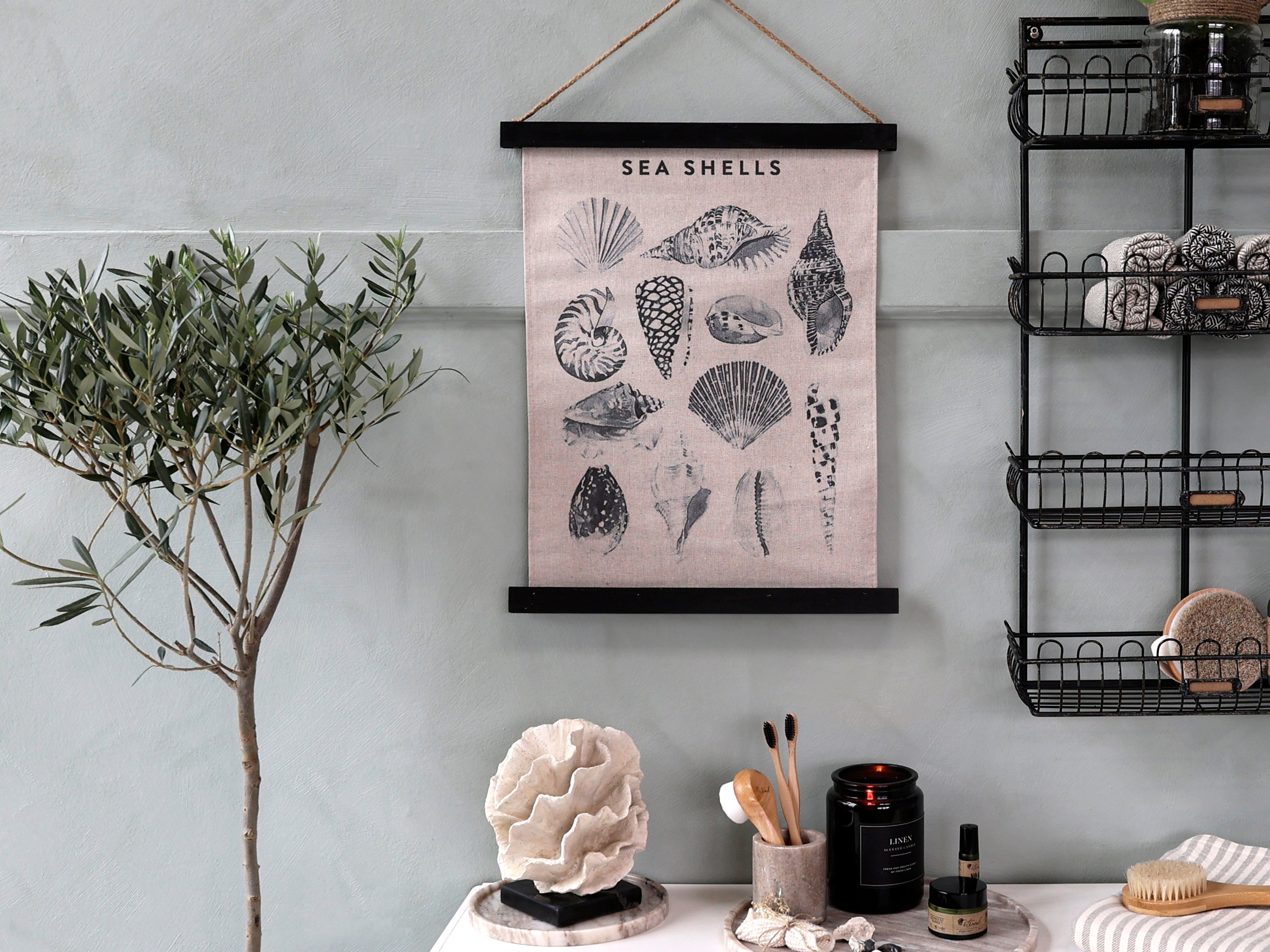 Canvas wall hanging featuring seashells