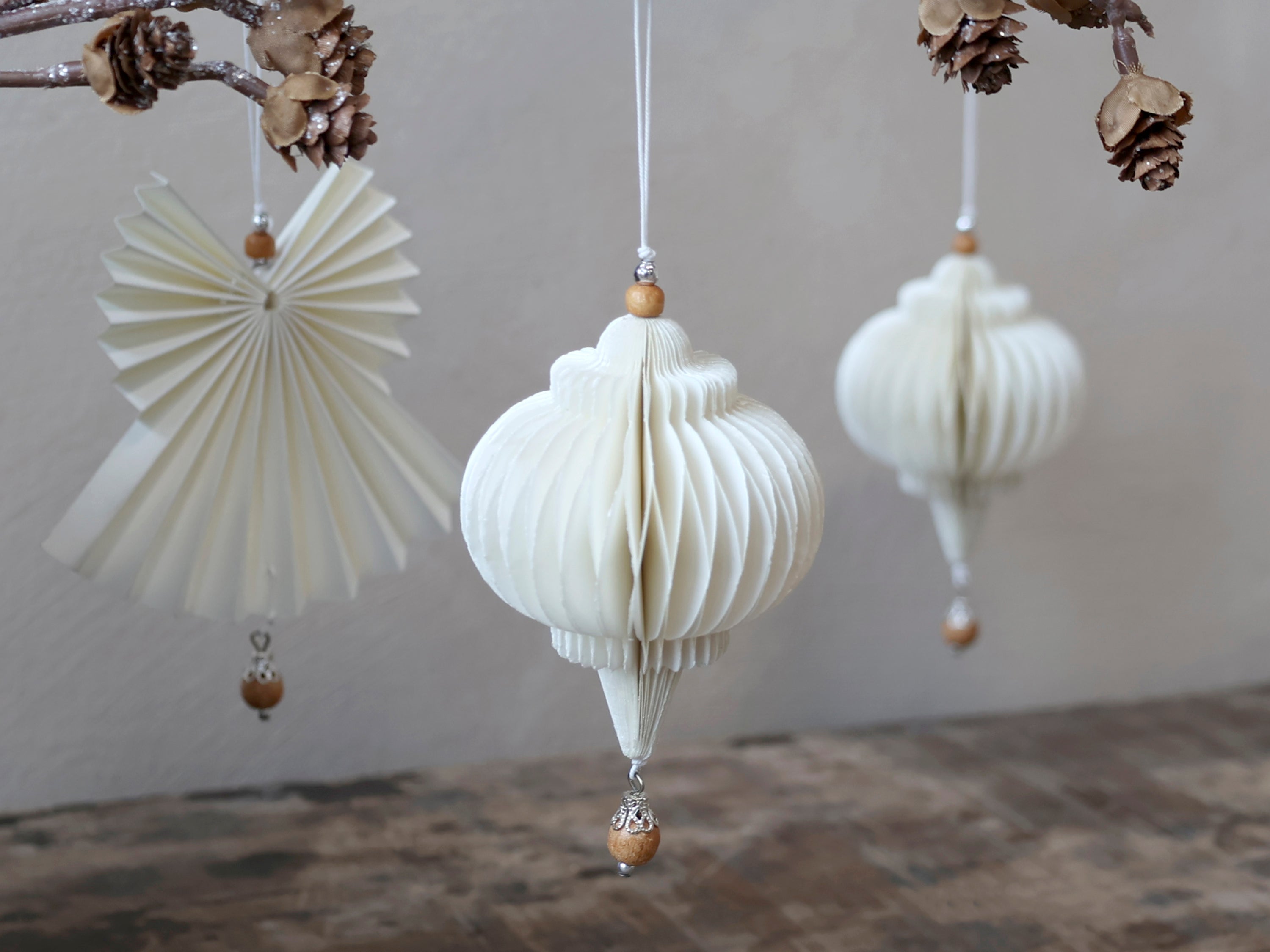 Paper drop ornament with wooden pearl