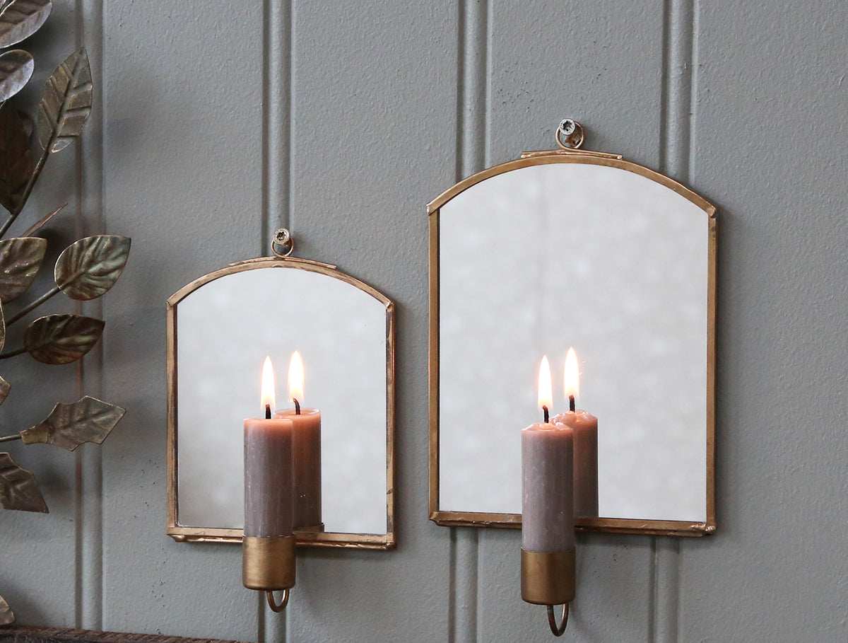 Antique brass mirror with candle holder