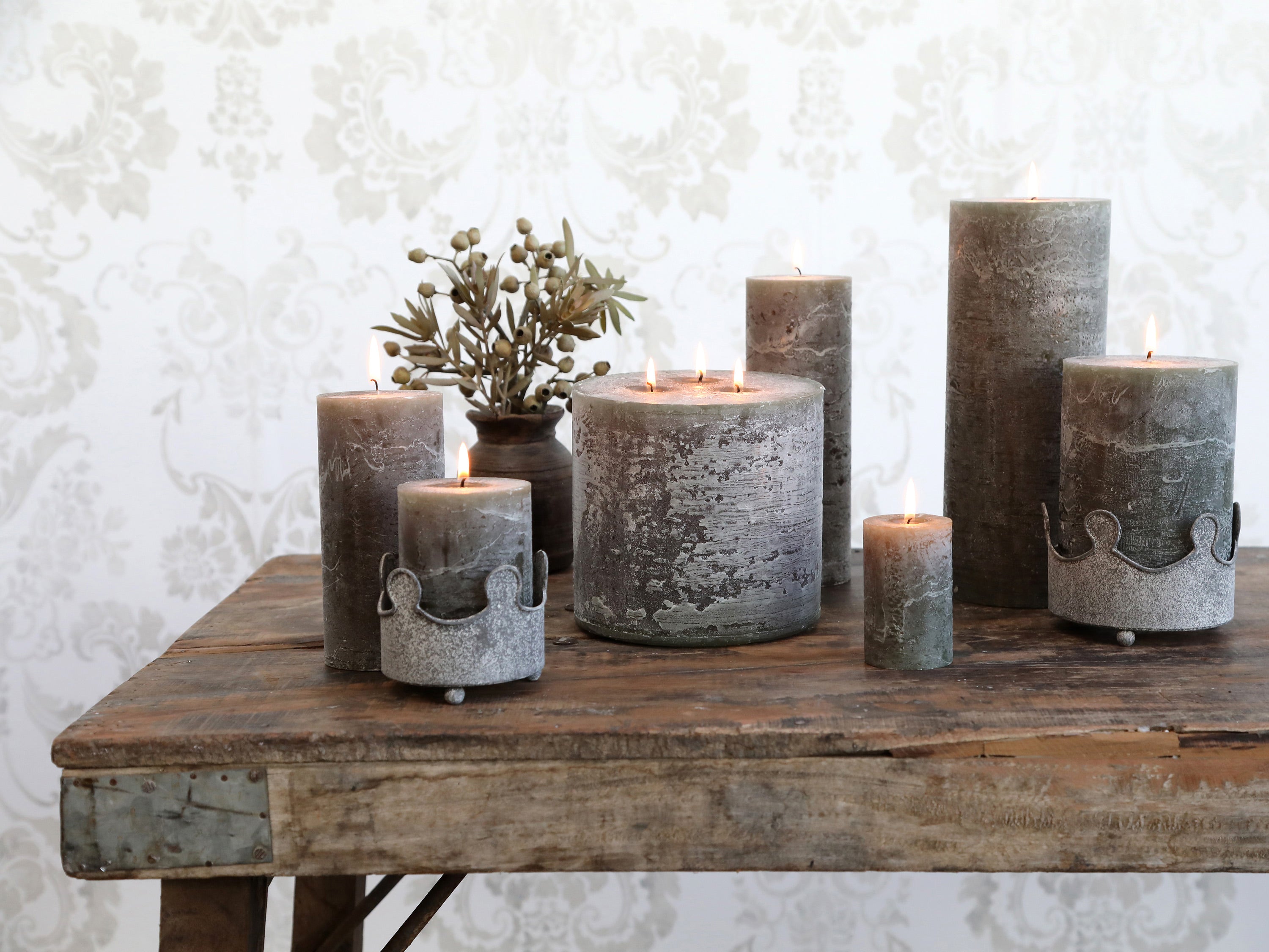 Rustic pillar candle in olive